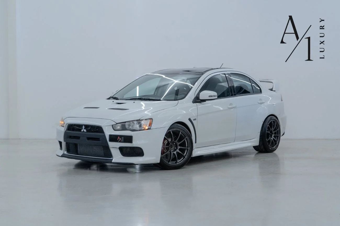 2015 Mitsubishi Lancer Evolution, biela, 107 750 km, dovoz SAE — foto 1 z 13 2015 Mitsubishi Lancer Evolution, biela, 107 750 km, dovoz SAE — foto 1 z 13