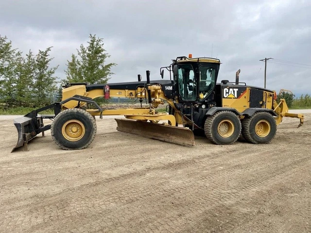 2011 Caterpillar 14M, 1 mth, dovoz Kanada — foto 1