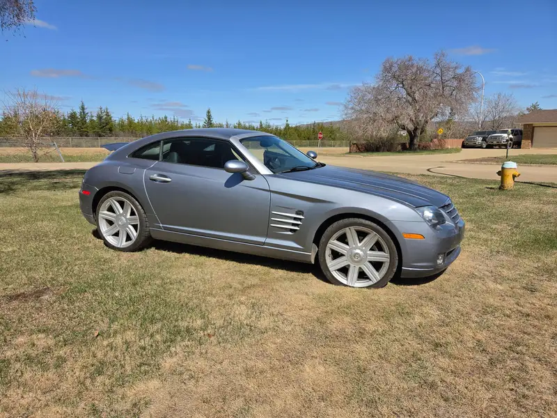 2004 Chrysler Crossfire Coupe, strieborná, 72 178 km, dovoz Kanada — foto 1 z 7 2004 Chrysler Crossfire Coupe, strieborná, 72 178 km, dovoz Kanada — foto 1 z 7