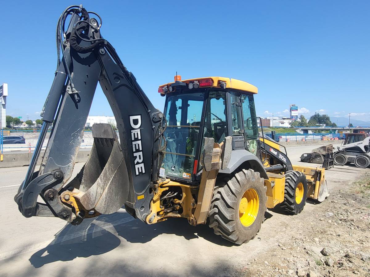 John Deere 310SL, dovoz Kanada — foto 1
