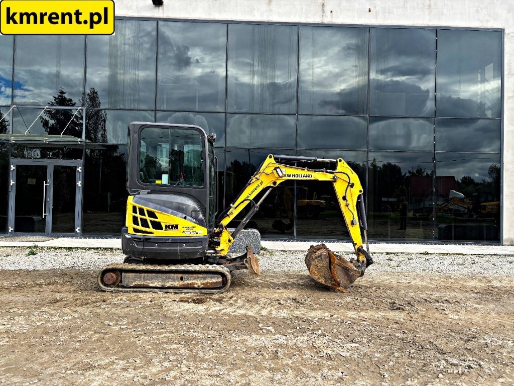 2012 New Holland E 26 B, 2 347 mth, dovoz Skladom v EÚ — foto 1