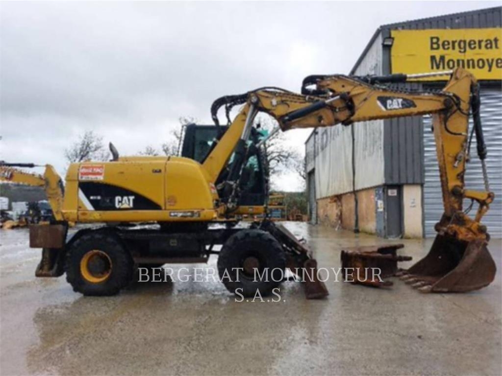 2012 Cat M313D, 7 326 mth, dovoz Skladom v EÚ — foto 1