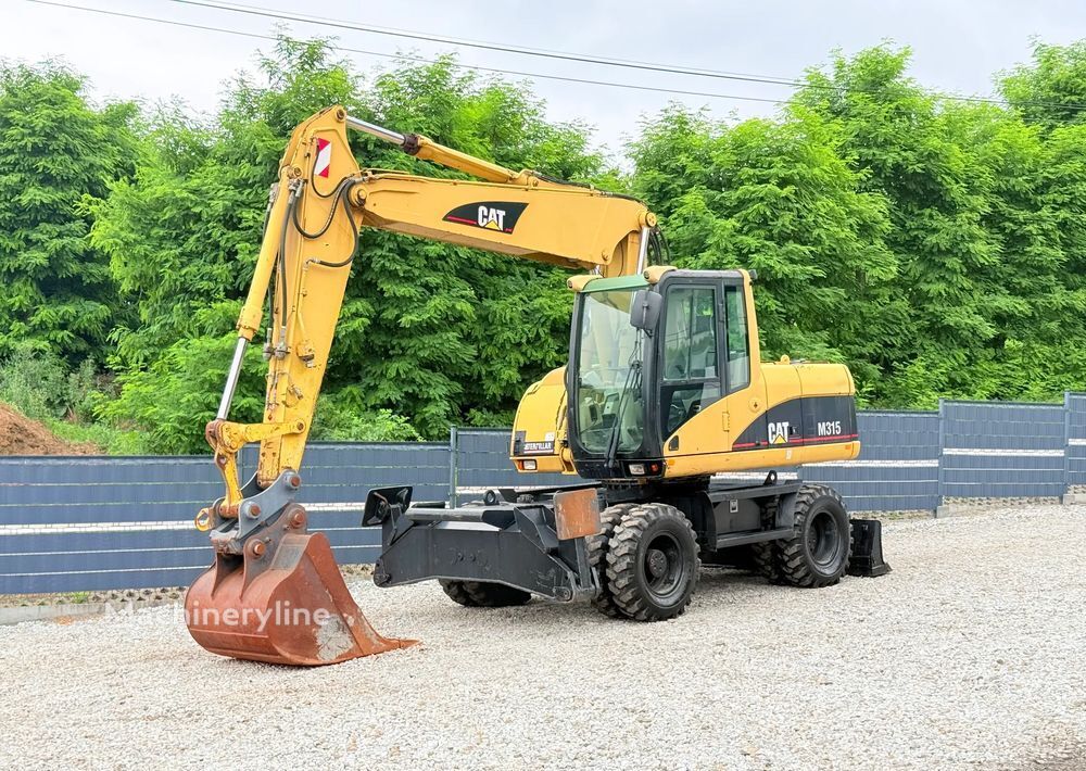 2003 Caterpillar M315C, 14 500 mth, dovoz Skladom v EÚ — foto 1