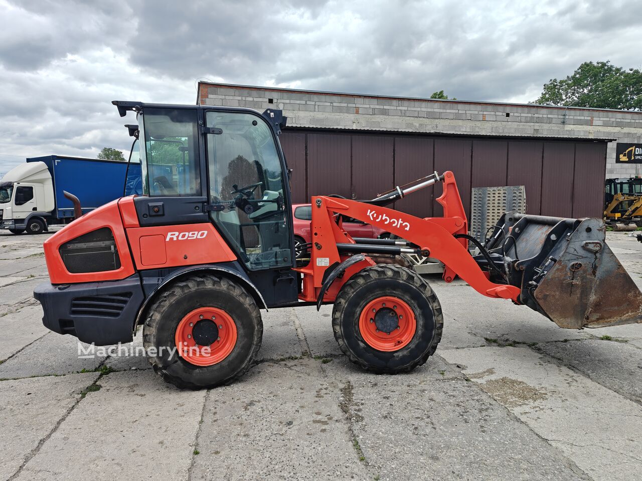2023 Kubota R090, 1 264 mth, dovoz Skladom v EÚ — foto 1 | AMECAR 2023 Kubota R090, 1 264 mth, dovoz Skladom v EÚ — foto 1